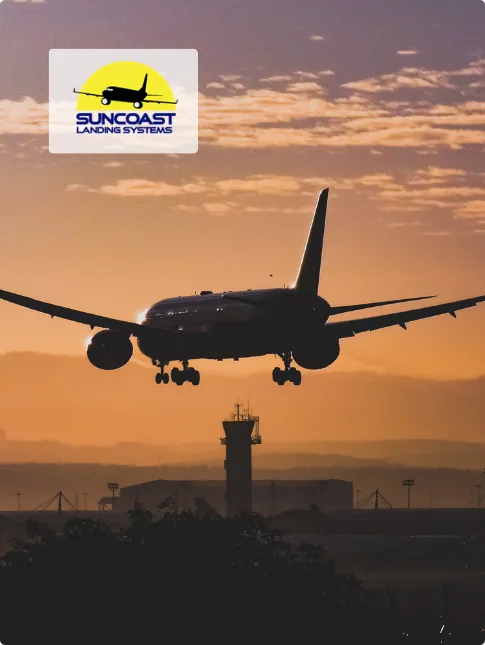 Airliner on final approach at sunset with landing gear extended