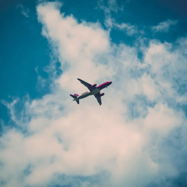 Airliner seen through an aircraft window against a bright sky